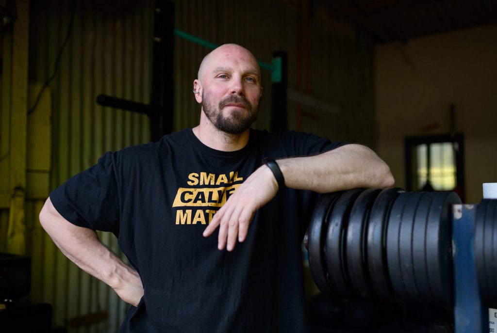Man standing with weights