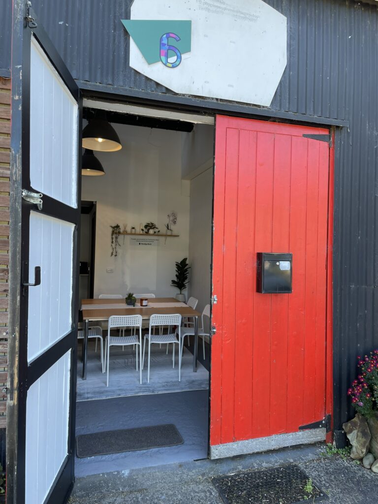The large red double doors opening into Studio 6